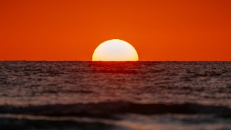 A photo of the setting sun. The debate over solar geoengineering is heating up.